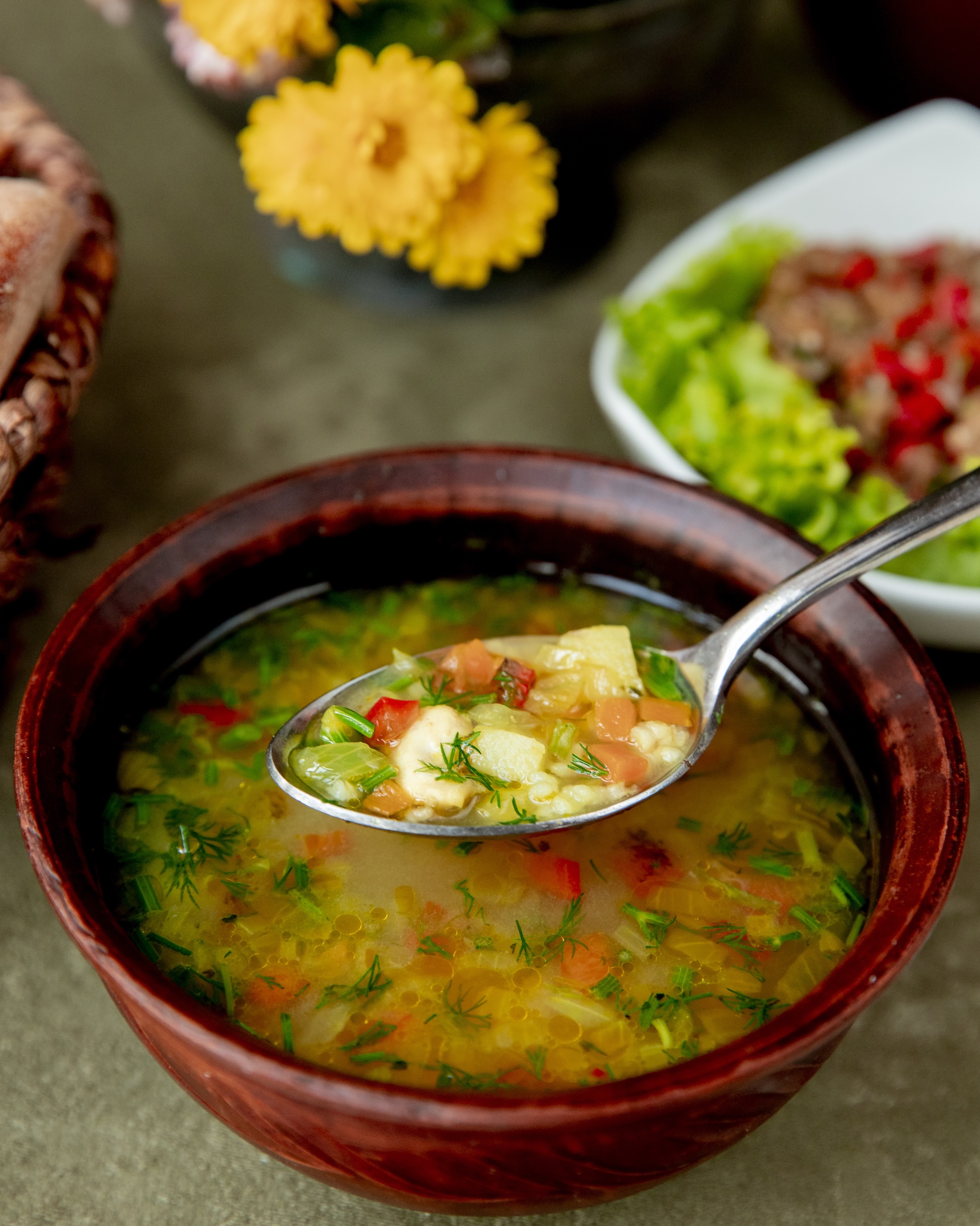 vegetable soup served with herbs